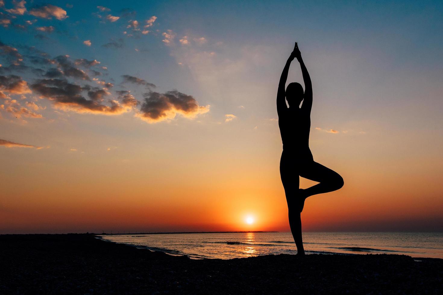 girl-on-the-beach-in-yoga-asana-free-photo